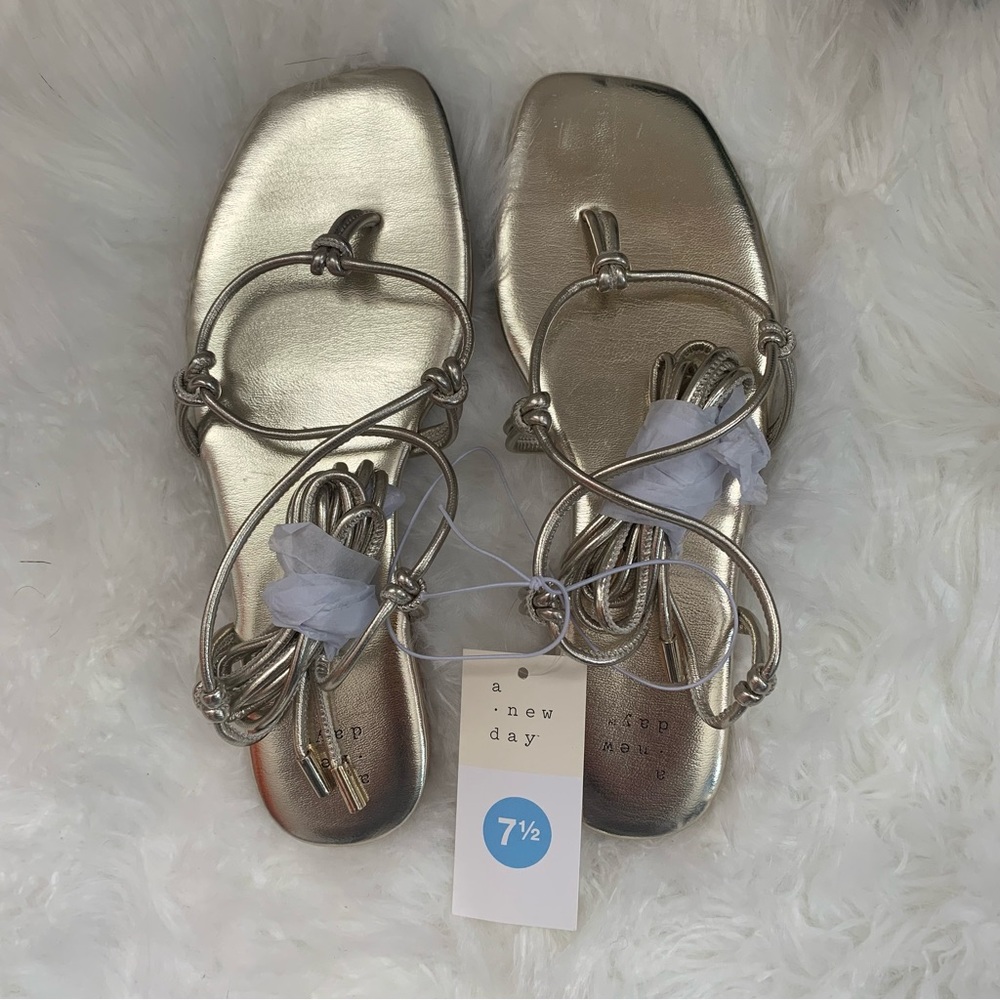 A new day golden tie up sandals. Size 7.5